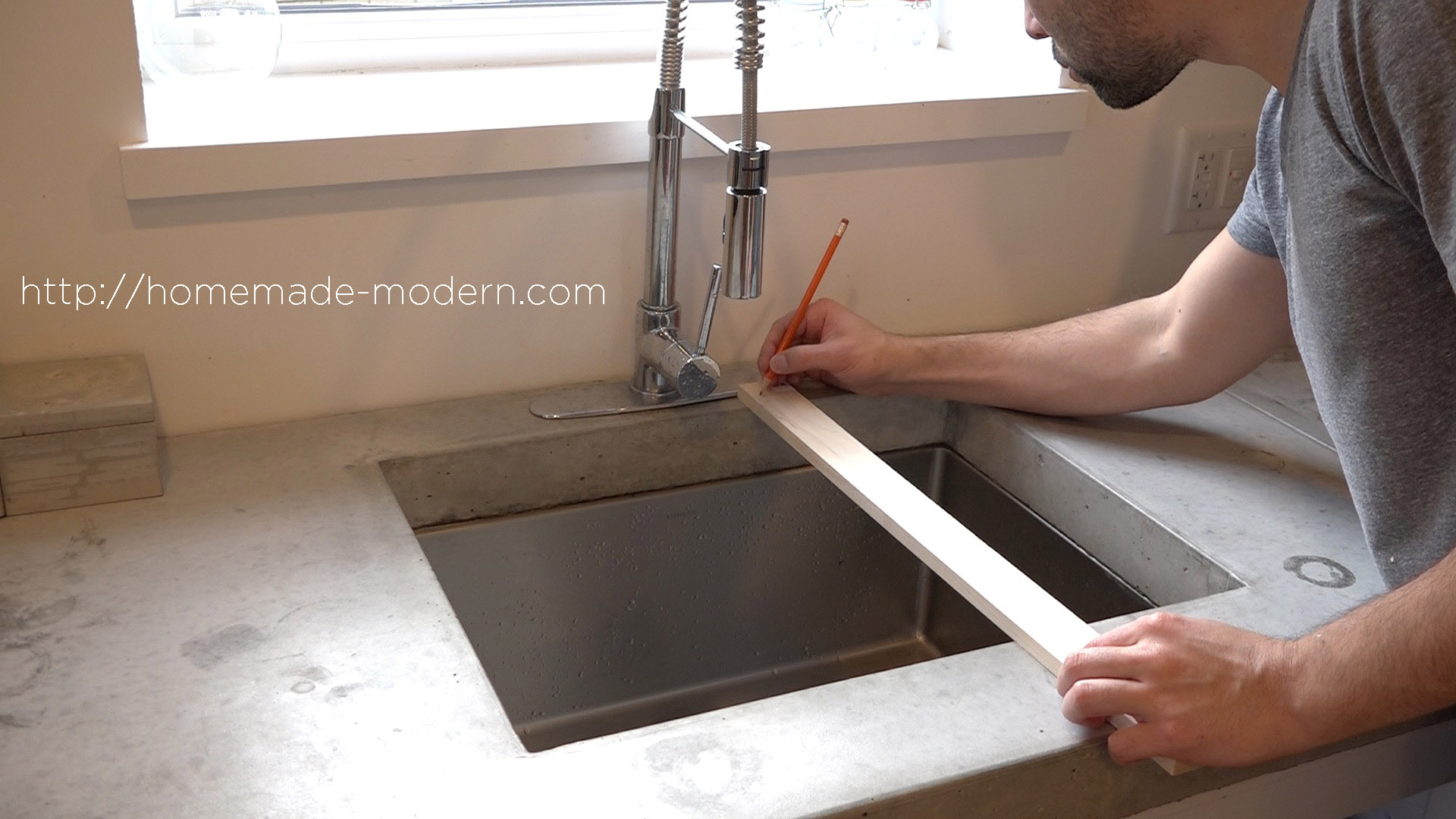 This DIY Dish Rack is designed to fit over a sink. Full instructions can be found at HomeMade-Modern.com