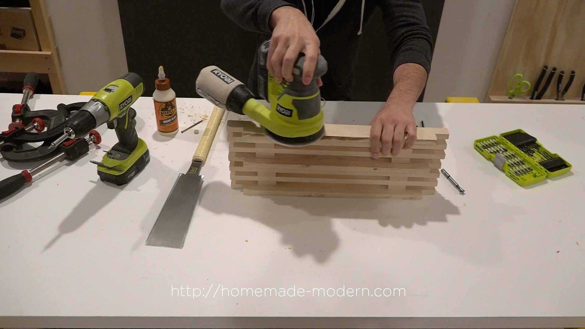 This DIY Dish Rack is designed to fit over a sink. Full instructions can be found at HomeMade-Modern.com