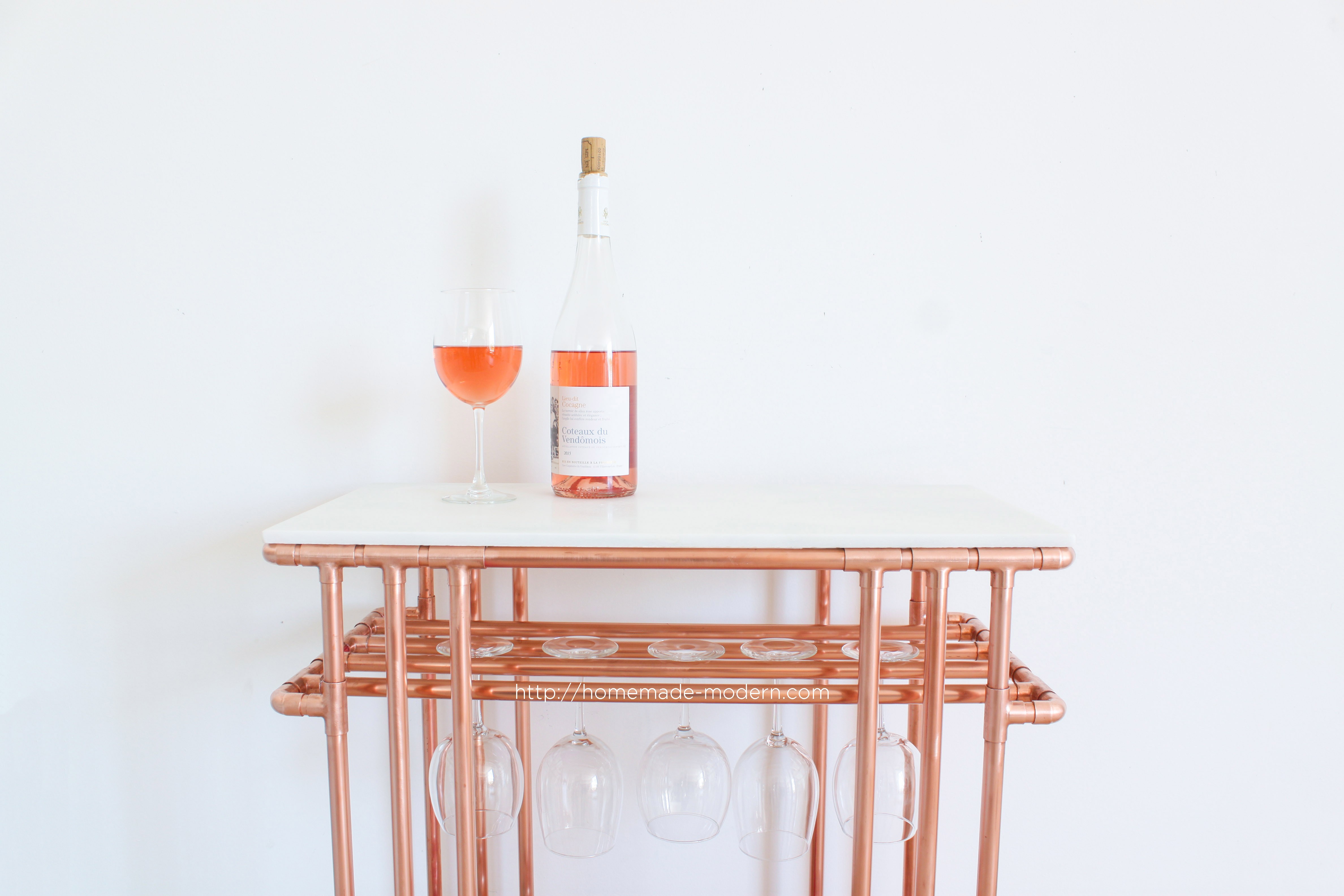 This DIY Copper Wine Bar is made entirely out of material from The Home Depot. Full instructions can be found at HomeMade-Modern.com