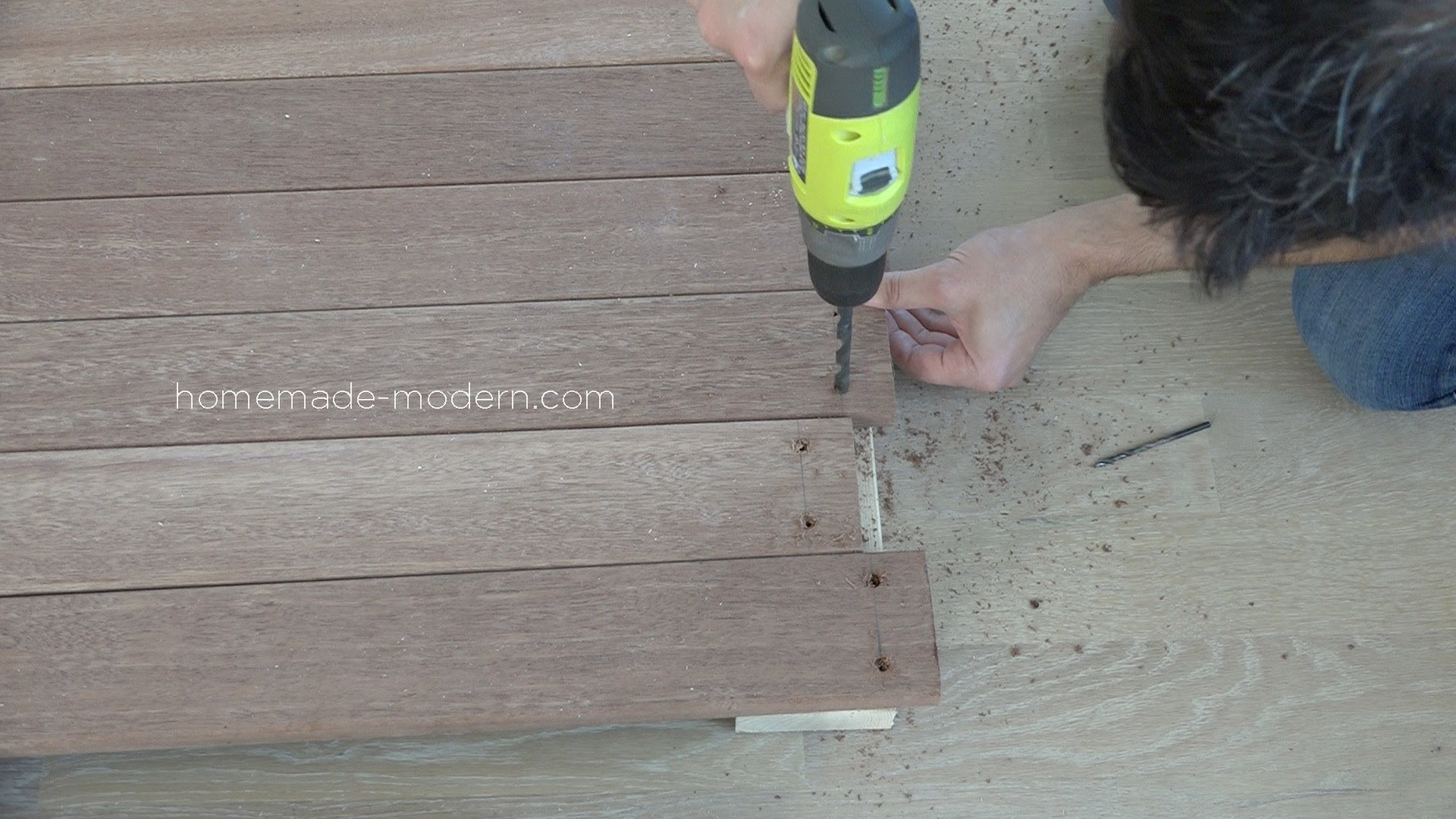 This DIY Outdoor Dining Table is made from painted 2x4s and hardwood deck boards. All the materials can be found at Home Depot. Full instructions can be found at HomeMade-Modern.com