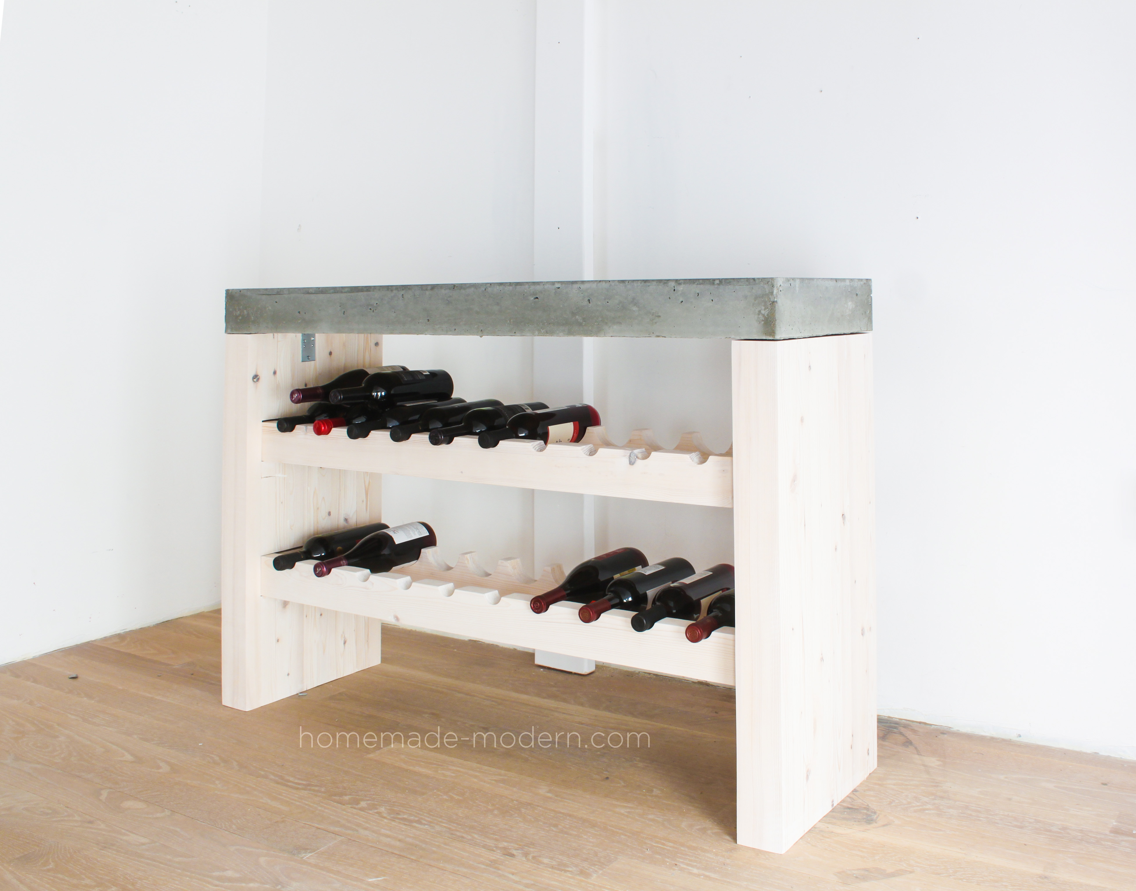 This DIY Wine Bar is made out of 2x4s and Quikrete 5000 concrete mix from Home Depot. Full instructions can be found at HomeMade-Modern.com