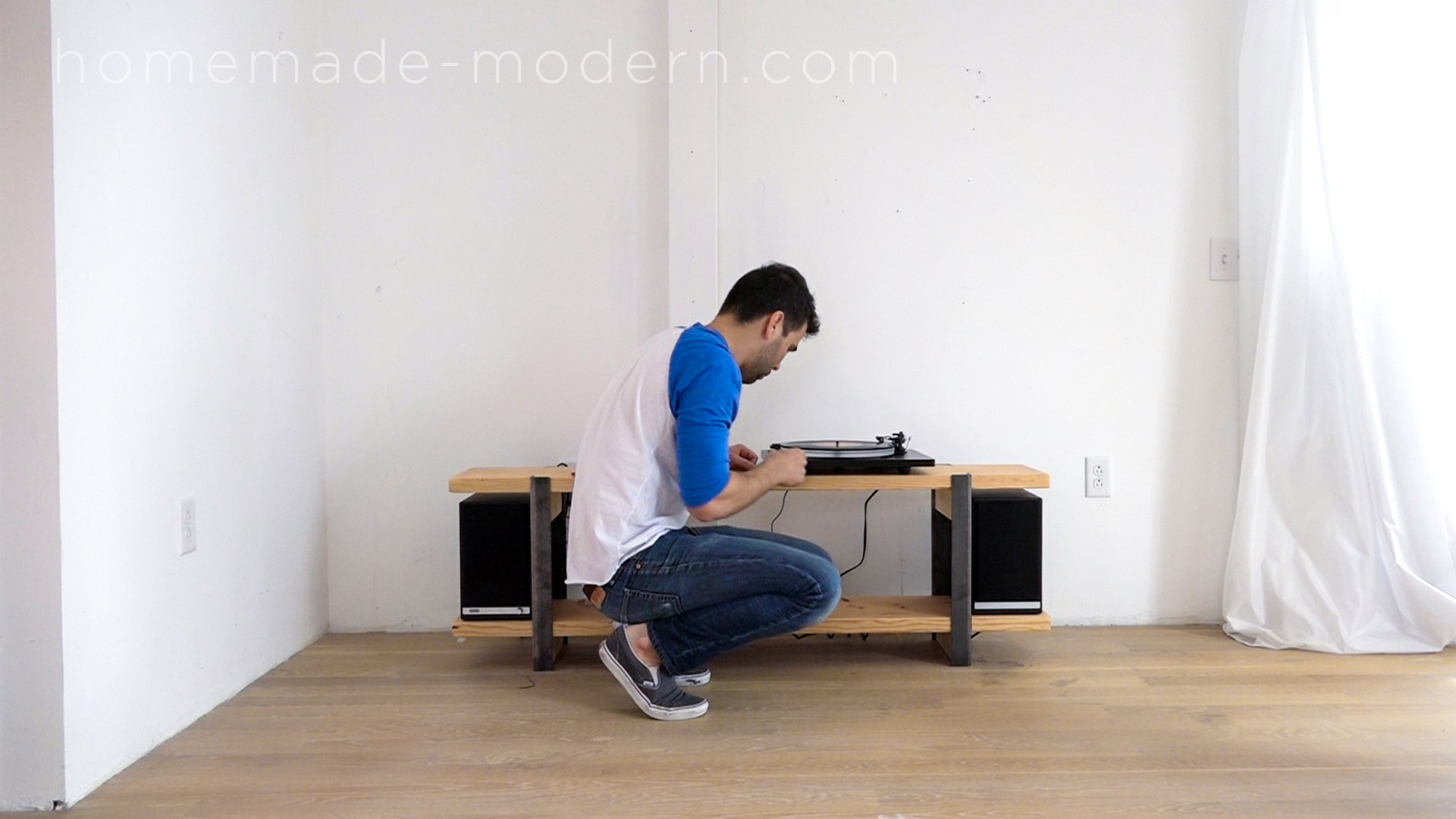 This DIY Media Console is made out of 2x12 and angle irons and the shelves were designed to store vinyl records. For more information go to HomeMade-Modern.com