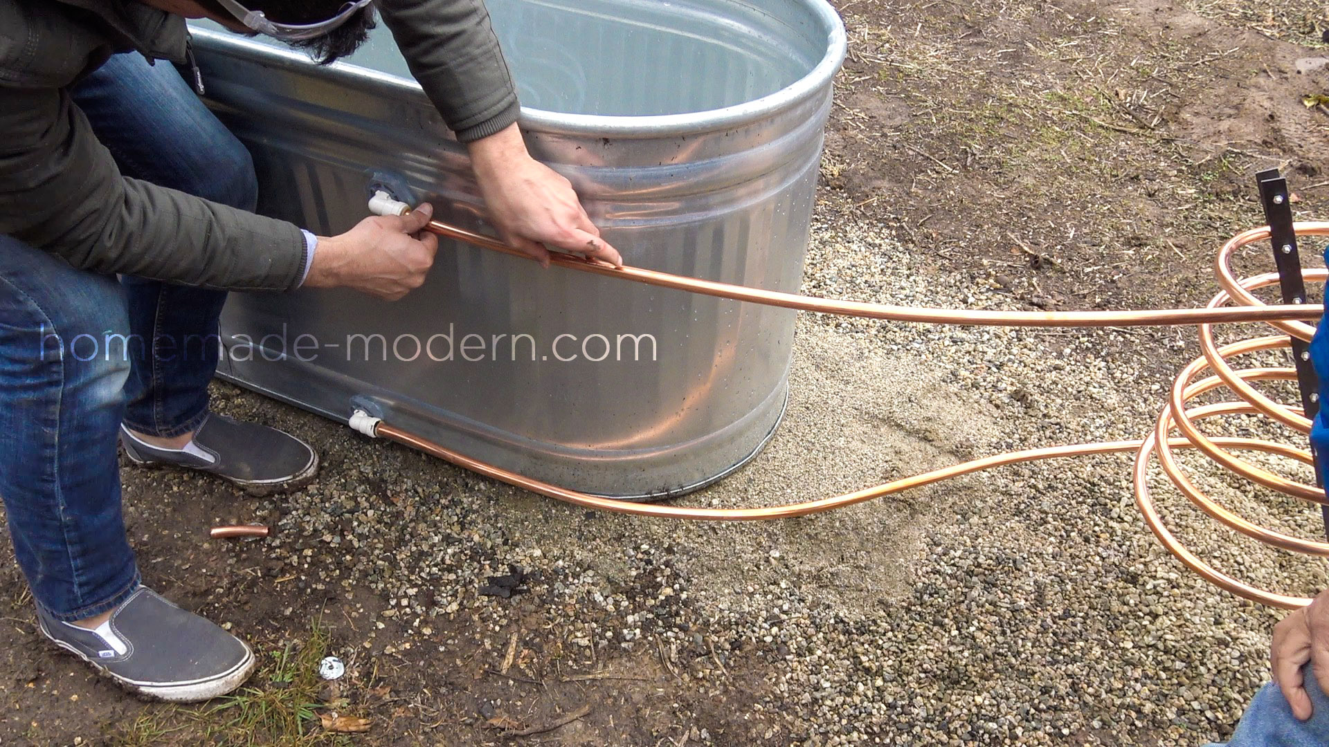 This DIY wood fired Hot Tub is made from a stock tank and copper tubing and...