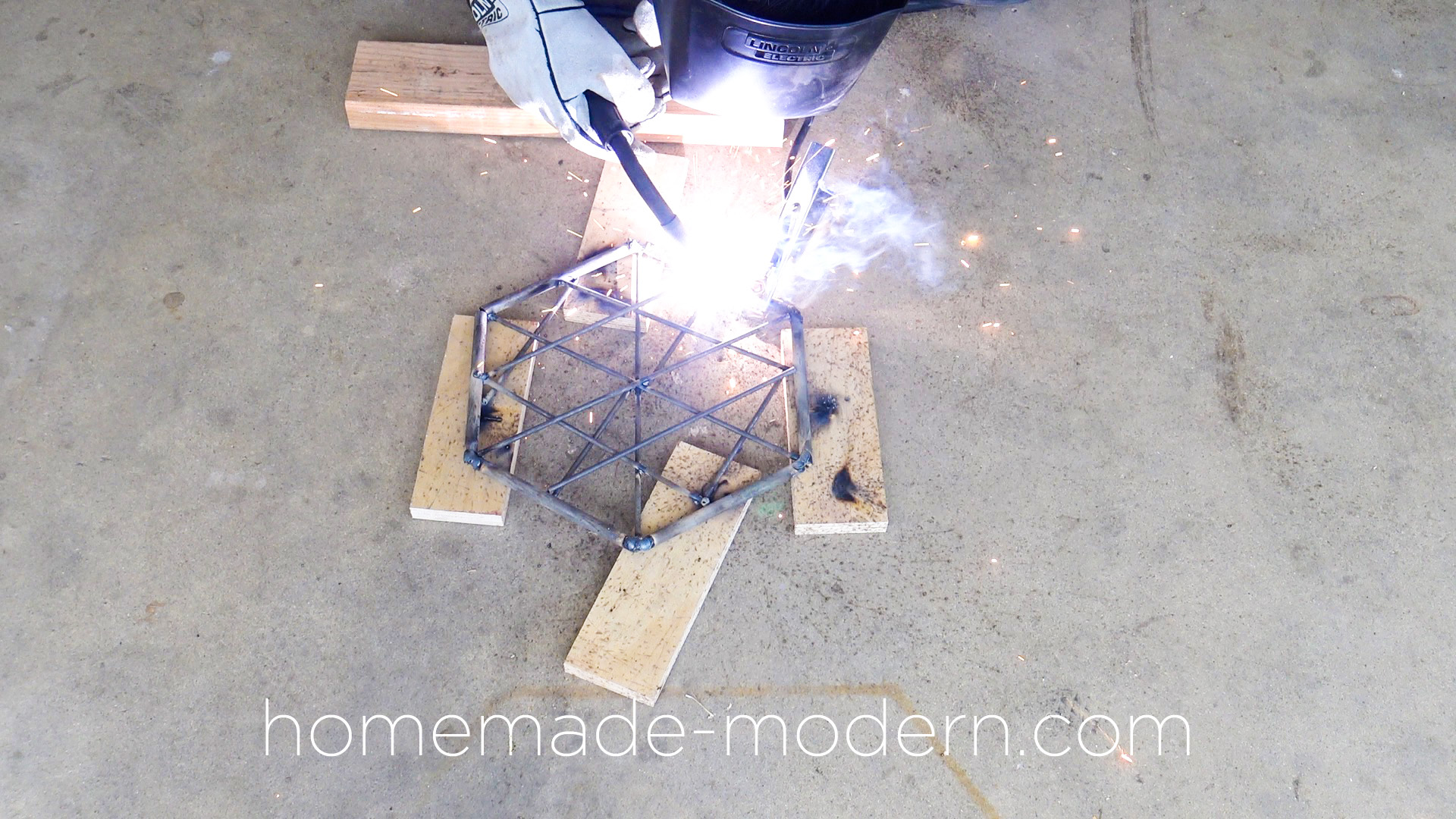 This DIY modern steel fire pit designed by Ben Uyeda is made out of steel rods from Home Depot that are welded together. For more information go to HomeMade-Modern.com