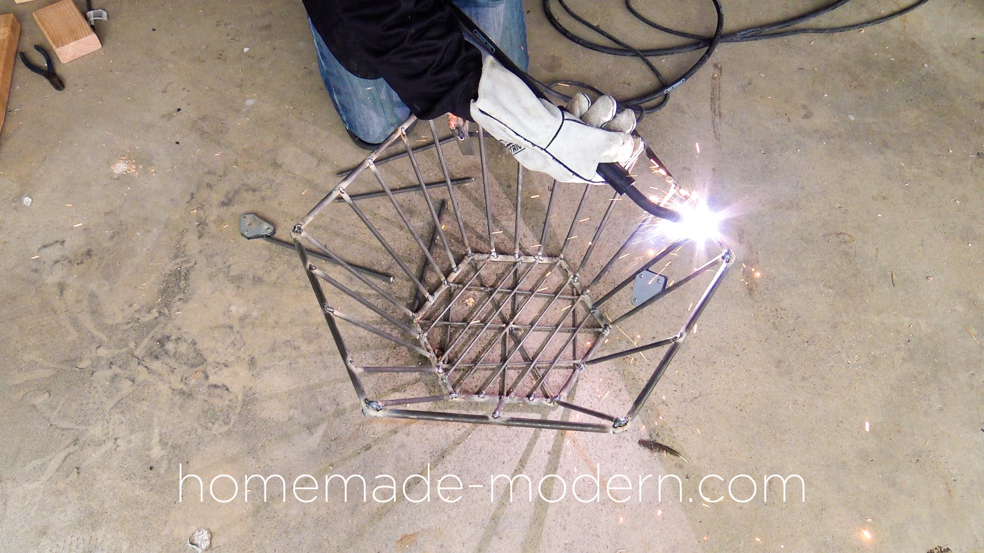 This DIY modern steel fire pit designed by Ben Uyeda is made out of steel rods from Home Depot that are welded together. For more information go to HomeMade-Modern.com