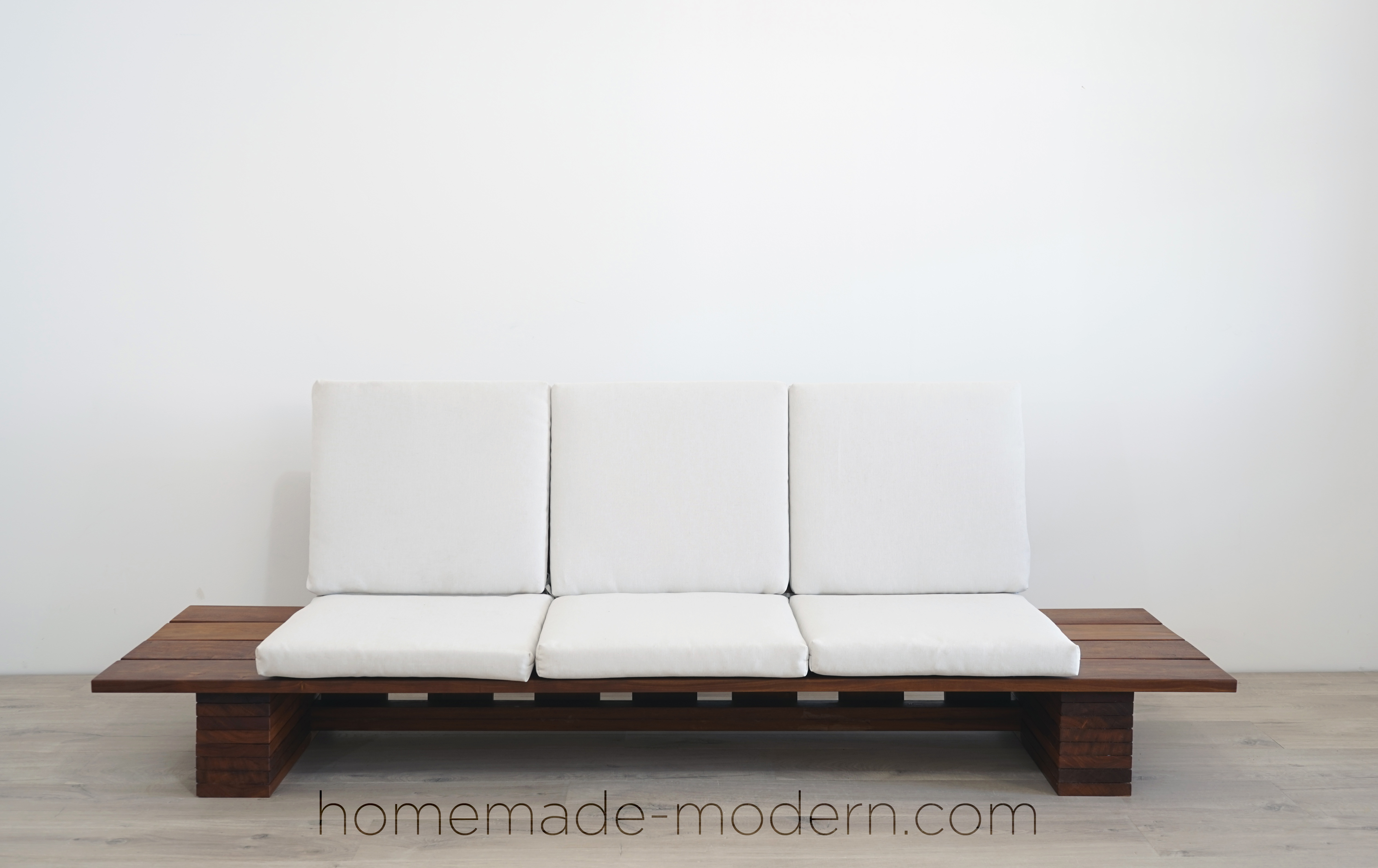 This DIY Outdoor sofa was made out of Cumaru Deck boards and outdoor cushions from Target. For more information go to HomeMade-Modern.com