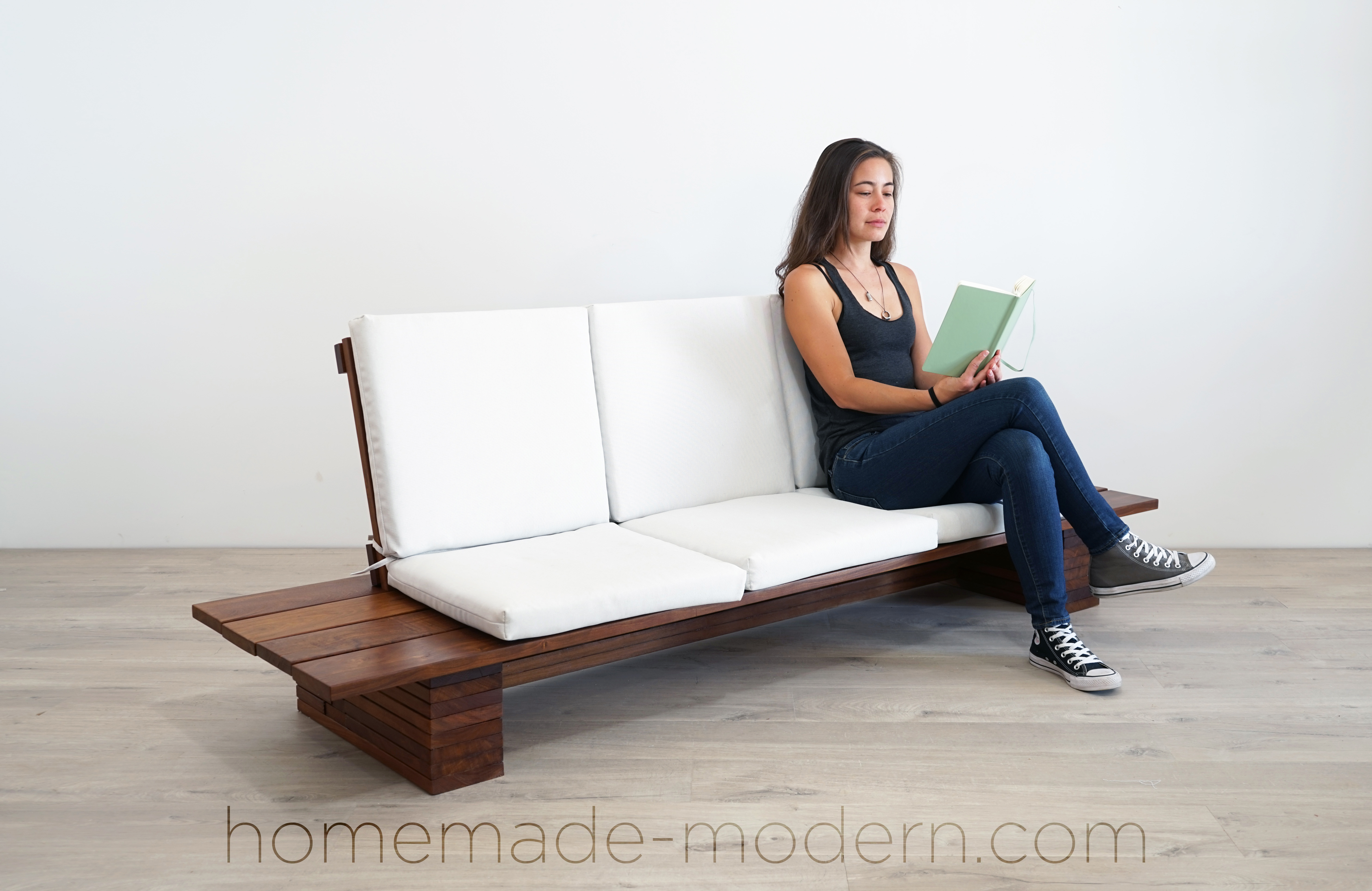This DIY Outdoor sofa was made out of Cumaru Deck boards and outdoor cushions from Target. For more information go to HomeMade-Modern.com